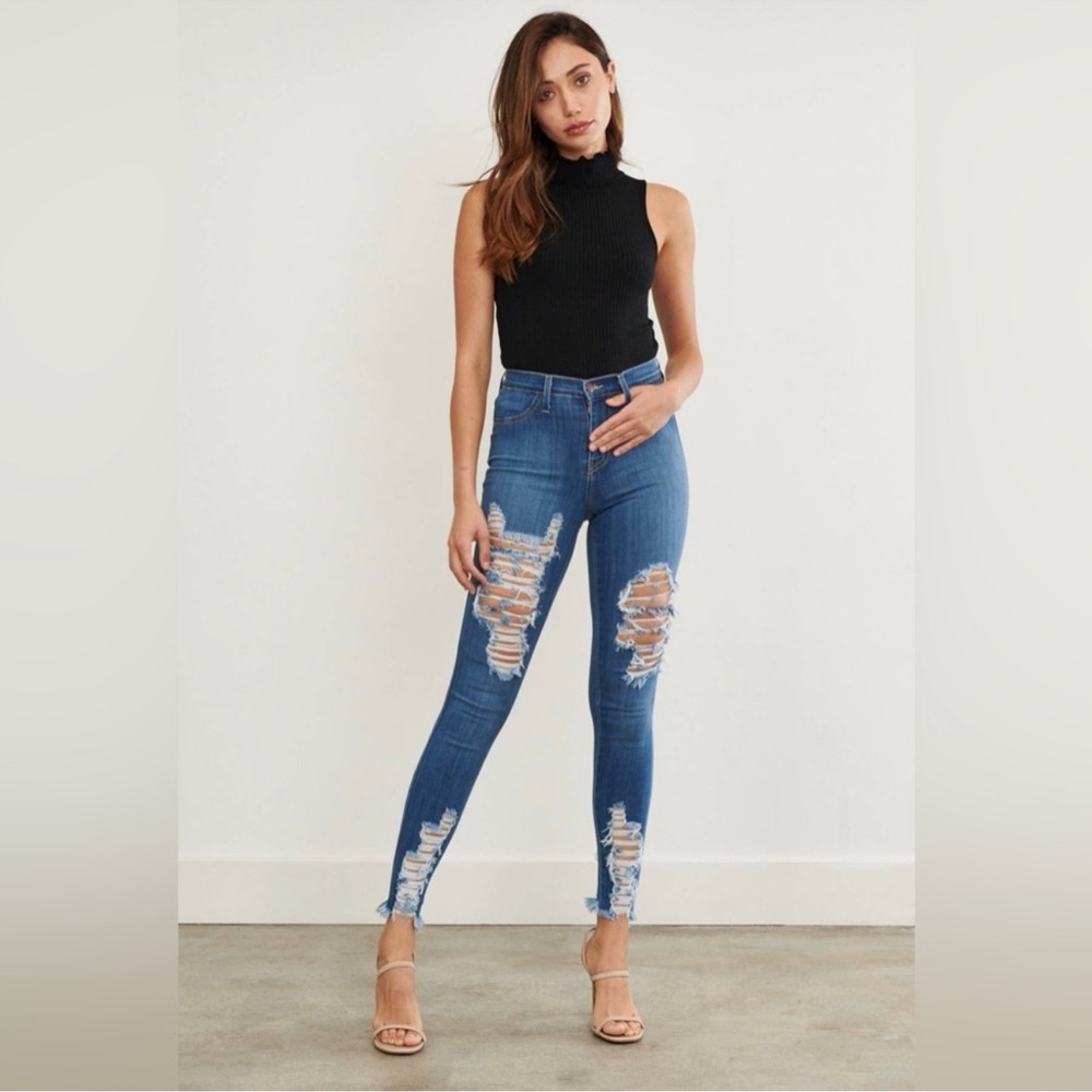 Vibrant M.I.U distress denim jeans with back pockets.